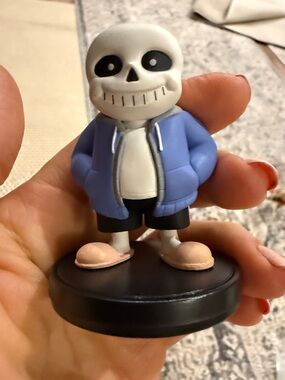 Sans Figure with Blue Jacket and Black Base